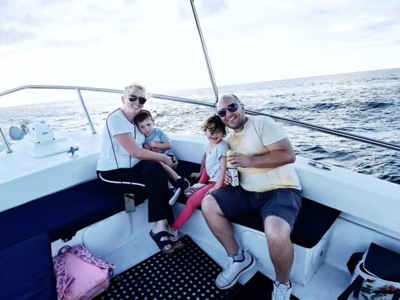 Family travelling by speedboat in Fiji