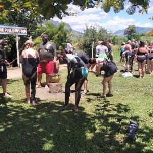 Guests applying mud at the Tifajek Mud Pool & Hot Spring in Nadi Fiji